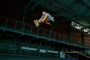 The man performs a trick. Jump. Indoor training photo