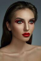 Close-up portrait of a beautiful fashion model with professional make-up. photo