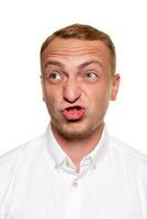 Handsome young blond man in a white shirt, isolated on a white background photo