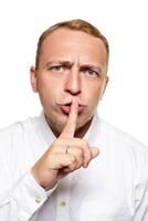 Handsome young blond man in a white shirt, isolated on a white background photo