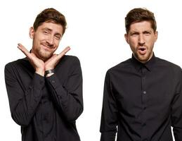 Handsome man in a black shirt makes faces, standing against a white background photo