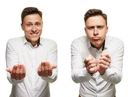 Young man with an expressive face, wearing white shirt, isolated on white background photo