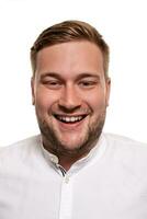 Close up horizontal portrait of a handsome man with a beard, stylish haircut, wearing a white shirt, isolated on a white background photo