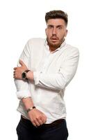 Studio photo of a good-looking man in a white shirt, isolated over a white background