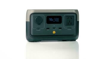 Portable power station or power box isolated on white background. On-the-Go energy solution. Power supply for outdoor adventure. Compact portable power box with a rechargeable lithium-ion battery. photo