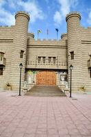 the entrance to the castle is made of stone and wood photo