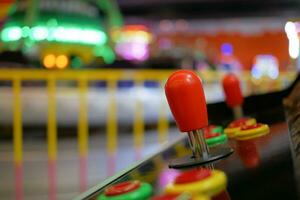 closeup of button on games machine. photo