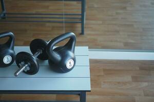 Gym Equipment or Dumbbell Kettlebell in a gym bench photo