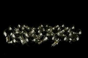 a group of clear glass bulbs on a black background photo