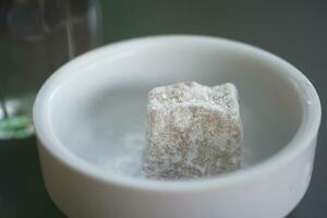 turkish delight or lokum of white in a small container photo