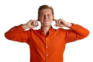 Close-up portrait of a ginger guy in orange shirt posing isolated on white background. Sincere emotions. photo