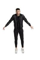 Full-length photo of a funny guy dancing in studio isolated on white background.