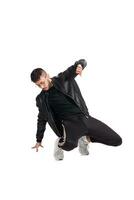 Full-length photo of a funny guy dancing in studio isolated on white background.