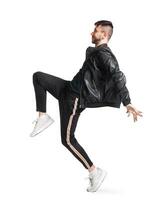 Full-length photo of a funny guy dancing in studio isolated on white background.