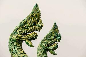 two green dragon statues photo