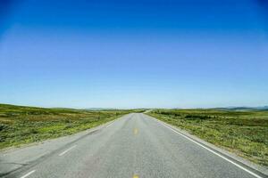 an empty road in the middle of nowhere photo