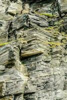 a jagged rock face photo