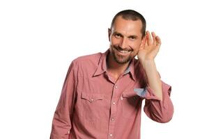 Middle-aged man with beard, mustache and short haircut posing isolated on white background. Sincere emotions concept. photo