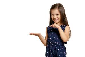 Close-up studio shot of beautiful brunette little girl posing isolated on white studio background. photo