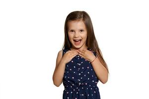 Close-up studio shot of beautiful brunette little girl posing isolated on white studio background. photo