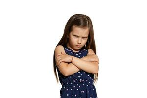 Close-up studio shot of beautiful brunette little girl posing isolated on white studio background. photo