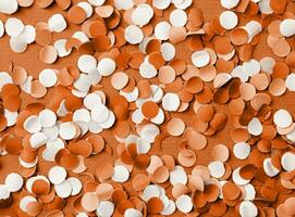 Color of the year 2024, Peach Fuzz.  colorful circle shape confetti from shredded paper photo