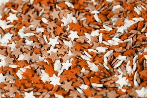Color of the year 2024, Peach Fuzz. colorful star shape sprinkes decorations for fourth july texture photo