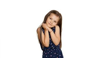 Close-up studio shot of beautiful brunette little girl posing isolated on white studio background. photo