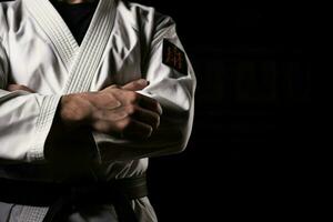 AI generated Karate master proudly clutches black belt, symbolizing expertise and mastery photo