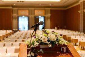 Microphone on podium in empty conference room photo