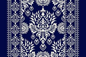Ikat floral paisley embroidery on navy blue background.Ikat ethnic oriental pattern traditional.Aztec style abstract vector illustration.design for texture,fabric,clothing,wrapping,decoration,scarf.