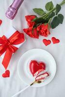 heart shaped glazed valentine cake in bed photo