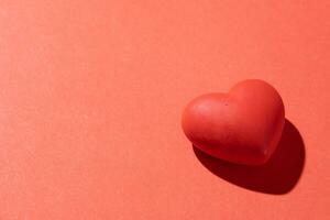 Valentines day. Red heart with copy space isolated on red photo