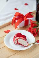 heart shaped glazed valentine cake and flowers on wooden tray photo