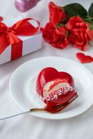 heart shaped glazed valentine cake in bed photo