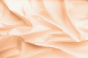 Color of the year 2024, Peach Fuzz. natural fabric linen texture for design photo