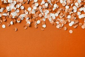 Color of the year 2024, Peach Fuzz. colorful circle shape confetti from shredded paper , decorations for fourth july photo