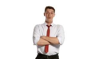 Portrait of a young brunet man posing in a studio isolated over a white background. photo