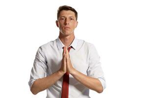 Portrait of a young brunet man posing in a studio isolated over a white background. photo