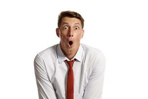 Portrait of a young brunet man posing in a studio isolated over a white background. photo