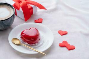 heart shaped glazed valentine cake in bed photo