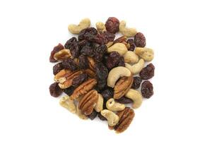 A handful of nuts and raisins, isolated on a white background. Nuts are so called because they all have one characteristic in common, they have less than 50 percent water photo