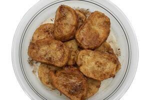 French toast, sweet widely consumed at Easter in Spain, called Torrijas. Isolated on white background. photo