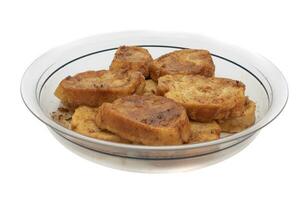 French toast, sweet widely consumed at Easter in Spain, called Torrijas. Isolated on white background. photo