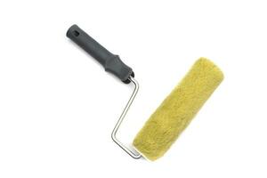 Paint roller to paint rough facades and concrete or cement walls. Isolated on white background. photo