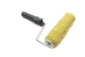 Paint roller to paint rough facades and concrete or cement walls. Isolated on white background. photo