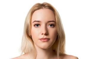 Young blonde woman without makeup on white background photo