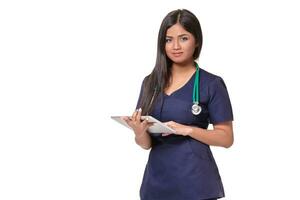 Young pretty doctor with a stethoscope and a medical history in her arms photo