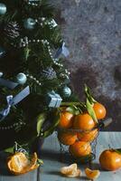 tangerines in a mesh bucket on a table , a background New Year's mood photo