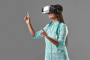 Young attractive doctor in a virtual reality glasses photo